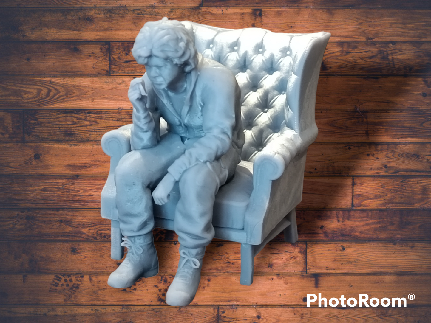 Akira Nakai-San figure smoking and sitting in chair