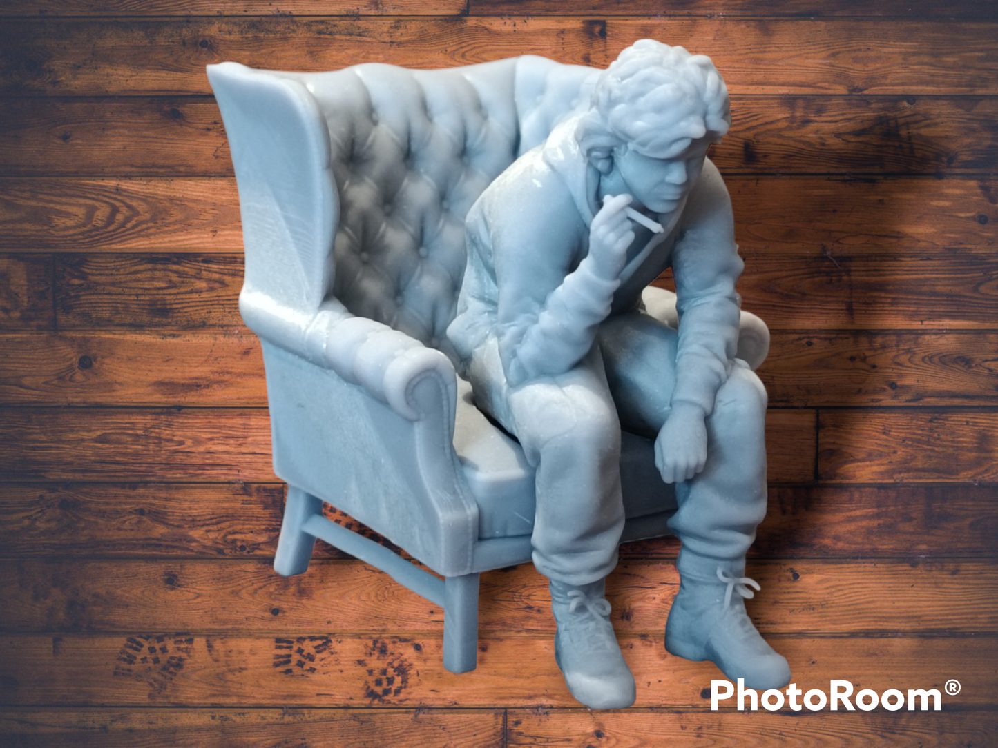 Akira Nakai-San figure smoking and sitting in chair