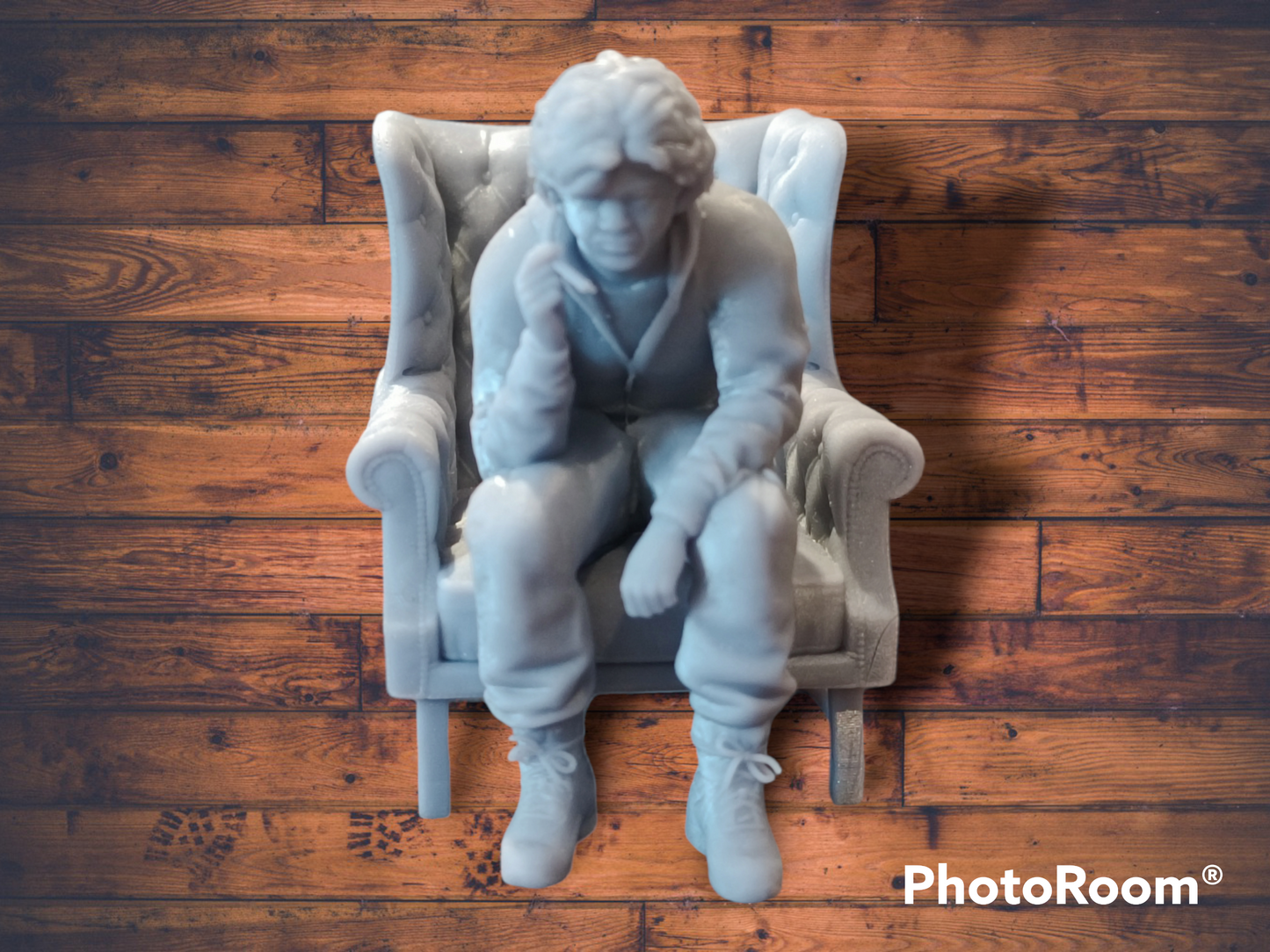 Akira Nakai-San figure smoking and sitting in chair